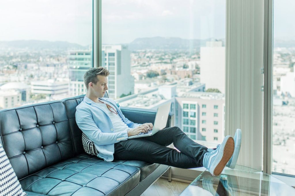 Young man sitting on sofa